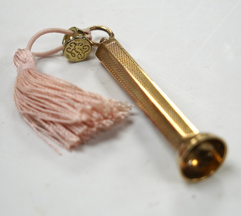 A modern engine turned 9ct gold cigar piercer, overall 67mm, gross weight 15.8 grams. Condition - fair